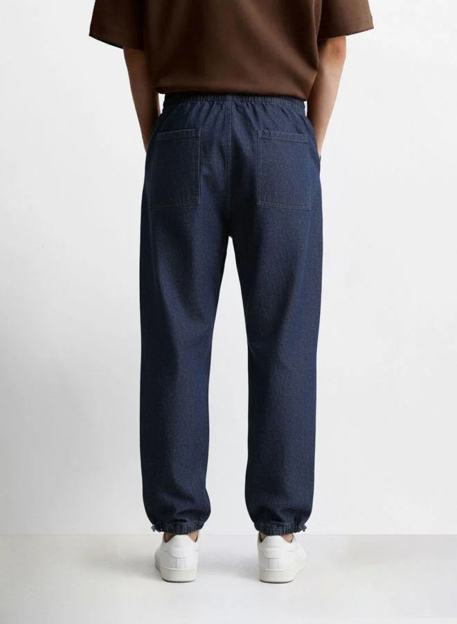 The Indian Garage Co  Men Relaxed Fit Solid Patch Pocket Mid-Rise Jeans for Men | Best Price UAE